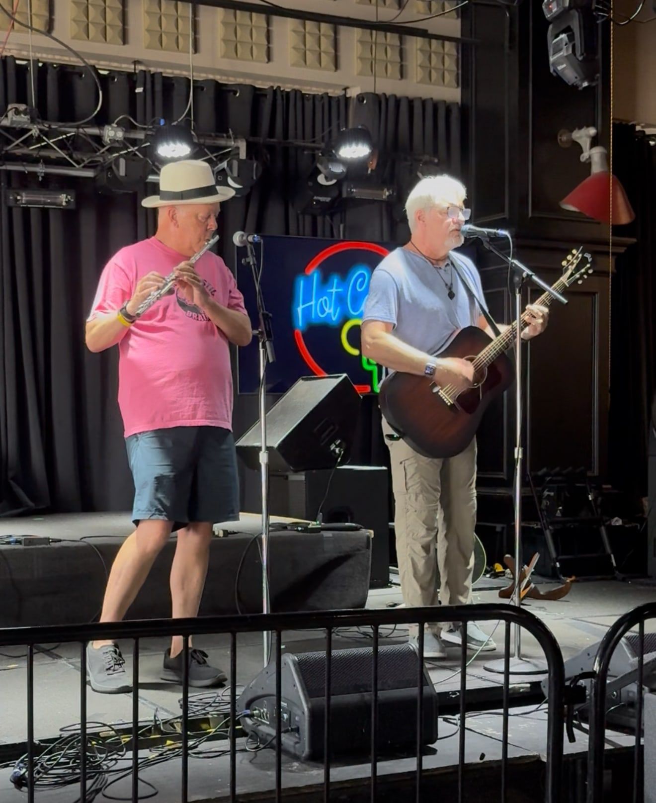 Hunt on flute and Frank on guitar and vocals on a stage at The Renegade